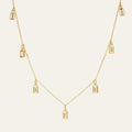 Gold necklace with pendant on a white background